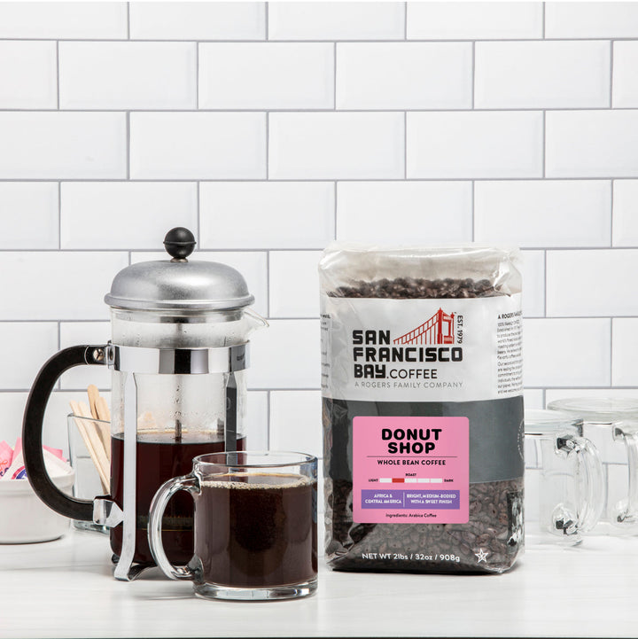 Image of french press, coffee cup and bag of Donut Shop Whole Beans