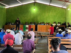 man talking to a group of people